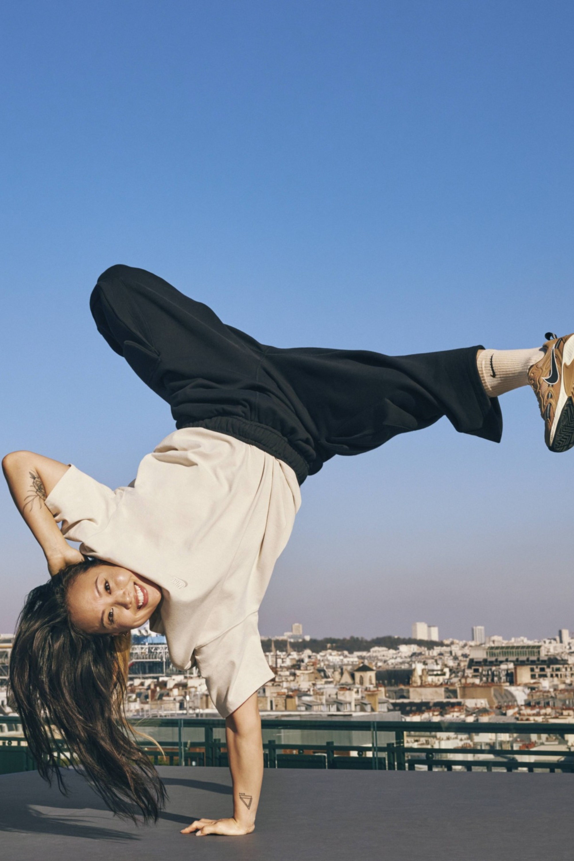 Image may contain Adult Person Clothing Footwear Shoe Fitness Handstand Sport Working Out Face and Head